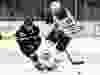 Boston Bruins defenceman Torey Krug knocks the puck away from Edmonton Oilers forwrd Leon Draisaitl during NHL action on Jan. 4, 2020, at TD Garden.