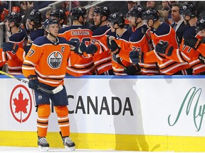 Edmonton Oilers forward Connor McDavid (97) celebrates with teammates on the bench after scoring a goal against the Arizona Coyotes at Rogers Place on Jan. 18, 2020.