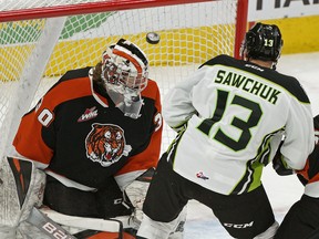 Edmonton Oil Kings Riley Sawchuk (13) scores on Medicine Hat Tigers goalie Mads Sogaard on Sunday, Jan. 19, 2020.
