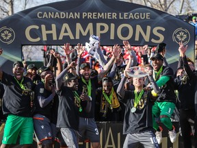 Forge FC players celebrate after defeating Cavalry FC during a Canadian Premier League soccer final match at Spruce Meadows.