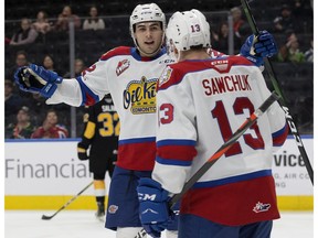 Edmonton Oil Kings Matthew Robertson (22) and Riley Sawchuk (13) celebrate a third period goal against the Brandon Wheat Kings at Rogers Place, on Tuesday, Jan. 28, 2020. The Oil Kings won 6-2.