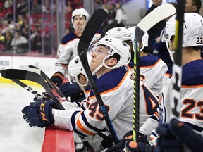 Tyler Benson (49) of the Edmonton Oilers watches from the bench against the Carolina Hurricanes at PNC Arena on Feb. 16, 2020, in Raleigh, N.C.