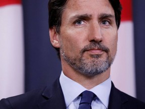 Prime Minister Justin Trudeau attends a news conference in Ottawa on Jan. 9 where he addressed the crash in Iran of a Ukrainian jet carrying many Canadians. (Reuters)