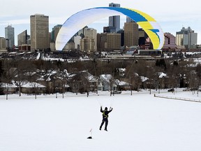 Jim Gerwing flies down a hill as he paraglides in Edmonton's Gallagher Park, Thursday Feb. 20, 2020. Photo by David Bloom