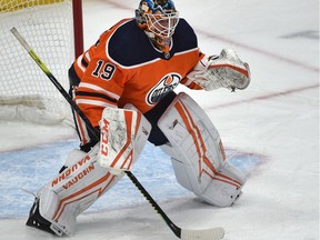 Edmonton Oilers goalie Mikko Koskinen (19) lost his goalie stick, now using Darnell Nurse's who received a penalty for tossing his stick against the San Jose Sharks during NHL action at Rogers Place on Feb. 6, 2020.