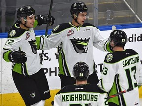Edmonton Oil Kings' Dylan Guenther (top) celebrates his goal with teammates against the Red Deer Rebels at Rogers Place on Feb. 7, 2020.