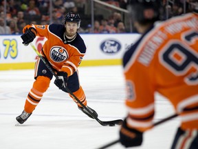 The Edmonton Oilers' Oscar Klefbom (77) makes a pass to Ryan Nugent-Hopkins (93) against the Nashville Predators at Rogers Place on Feb. 8, 2020.