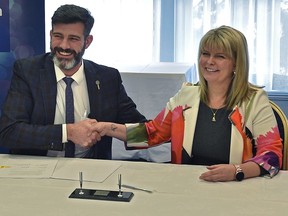 Mayor Don Iveson and City of St. Albert Mayor Cathy Heron offficially signing the Intermunicipal Collaboration Framework on funding and delivering recreation services to residents between the two cities, in Edmonton, February 13, 2020. Ed Kaiser/Postmedia