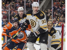 Kailer Yamamoto of the Edmonton Oilers, plays in the shadow on Zdeno Chara of the Boston Bruins at Rogers Place in Edmonton on February 19, 2020.