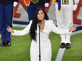 US singer Demi Lovato sings the National Anthem during Super Bowl LIV between the Kansas City Chiefs and the San Francisco 49ers at Hard Rock Stadium in Miami Gardens, Florida, on February 2, 2020.