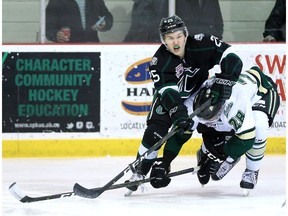 Centre Tanner Fincaryk of the Sherwood Park Crusaders plays the puck against the Okotoks Oilers earlier this season. Sherwood Park has a bye in the opening round of the AJHL playoffs.