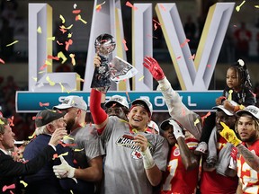 Kansas City Chiefs quarterback Patrick Mahomes celebrates with the Vince Lombardi trophy after winning the Super Bowl at Hard Rock Stadium in Miami. (REUTERS/Shannon Stapleton)