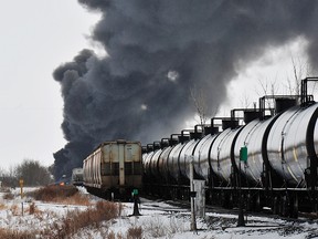 A smoke rises from a fire at the site of a CP Rail train car derailment near Guernsey, Sask., Feb. 6, 2020.