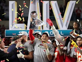 Kansas City Chiefs' Patrick Mahomes celebrates with the Vince Lombardi trophy after winning the Super Bowl LIV.