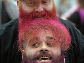 Len Vingar, top, and Levani Kotchlamazashvili get their hair and beards dyed pink at West Edmonton Mall on Friday, Feb. 21, 2020, to help raise money in support of Albertans facing cancer. Thousands of heads were shaved at the annual event in honour of the journey of sick children losing their hair due to chemotherapy.