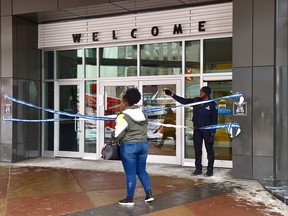 The east entrance to the Edmonton City Centre Mall is blocked by security as police investigate an early morning stabbing on Thursday, Feb. 13, 2020.
