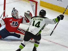 Edmonton Oil Kings' Josh Williams (14) flips the puck past Lethbridge Hurricanes goalie Carl Tetachuk (35) at Rogers Place on Feb. 17, 2020.