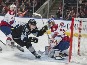 Edmonton Oil Kings goalie Sebastian Cossa watches as Mike Ladyman of the Winnipeg Ice loses control of the puck in front of the net at Rogers Place on Saturday, Feb. 1, 2020.