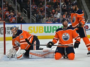Edmonton Oilers goalie Mikko Koskinen (19), Adam Larsson (6) and Darnell Nurse (25) react after a San Jose Sharks goal in the second period at Rogers Place  on Thursday, Feb. 6, 2020.