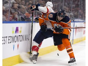 The Edmonton Oilers' Leon Draisaitl (29) checks the Florida Panthers' Mark Pysyk (13) at Rogers Place on Jan. 10, 2019.