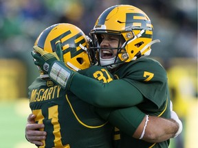 The Edmonton Eskimos running back Calvin McCarty (31) and quarterback Trevor Harris (7) celebrate McCarty's touchdown against the Saskatchewan Roughriders during first half CFL action at Commonwealth Stadium in Edmonton Saturday Oct. 26, 2019.