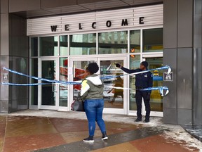 The east entrance to the Edmonton City Centre Mall is blocked by security as police investigate an early morning stabbing on Thursday, Feb. 13, 2020.