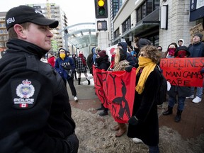 Approximately 60 protesters rally in solidarity with Wet'suwet'en Hereditary Chiefs, as they march along Jasper Avenue near 108 Street, in Edmonton Friday Feb. 14, 2020. Approximately 20 Edmonton Police Service members were on hand during the protest.  Photo by David Bloom