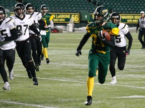 A player of the Fort Saskatchewan Sting pushes for the end zone during the Metro football high school championship game on Nov. 8, 2019, at Commonwealth Stadium.