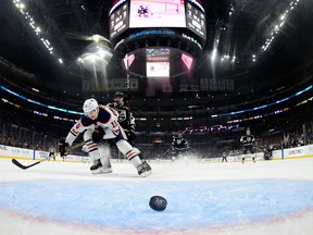 LOS ANGELES, CALIFORNIA - Josh Archibald (15) of the Edmonton Oilers scores an empty net goal in front of Martin Frk (29) of the Los Angeles Kings in a 4-2 Oilers win at Staples Center on Feb. 23, 2020, in Los Angeles, Calif.