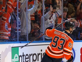 Edmonton Oilers' Ryan Nugent-Hopkins (93) celebrates a goal on Winnipeg Jets goaltender Connor Hellebuyck (37) at Rogers Place on Saturday, Feb. 29, 2020.