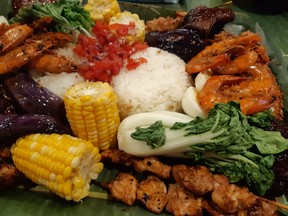 A Filipino Kamayan/boodle fight feast is a treat for the eyes and the stomach. Photos by GRAHAM HICKS / EDMONTON SUN