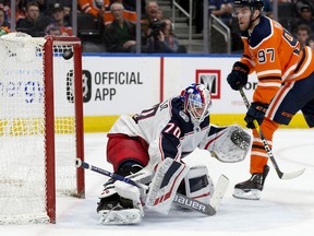 Edmonton Oilers' Connor McDavid scores on Columbus Blue Jackets goalie Joonas Korpisalo (70) at Rogers Place on March 21, 2019.