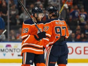 Edmonton Oilers Connor McDavid and Leon Draisaitl cross paths at the end of a game against the St. Louis Blues at Rogers Place on Nov. 6, 2019.