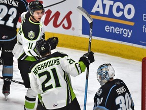 Edmonton Oil Kings forward Dylan Guenther (11) celebrates his goal wtih Jake Neighbours (21), setting a club record for rookie points after scoring on Winnipeg Ice goalie Liam Hughes (30) at Rogers Place on Feb. 25, 2020.