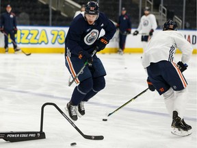 Oilers' Patrick Russell (52) and Darnell Nurse (25) drill during an Edmonton Oilers practice ahead of their Saturday game against the Columbus Blue Jackets at Rogers Place, on Friday, March 6, 2020.