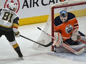 Edmonton Oilers goalie Mikko Koskinen (19) stops the puck on Vegas Golden Knights Jonathan Marchessault at Rogers Place on Monday, March 9, 2020.