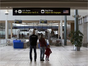 The area in front of the United States bag drop at the Edmonton International Airport on Tuesday, March 17, 2020, in Edmonton. Edmonton International Airport will stop taking international flights starting Wednesday, the federal government has announced. Just four airports in the country -- including Calgary, Vancouver, Toronto and Montreal -- will continue to receive international flights.