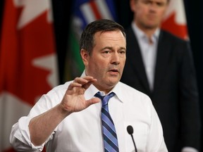 Premier Jason Kenney speaks at a press conference about the COVID-19 pandemic with Dr. Deena Hinshaw, Chief Medical Officer of Health, and Tyler Shandro, Minister of Health, at the Alberta Legislature in Edmonton, on Wednesday, March 25, 2020. Photo by Ian Kucerak/Postmedia