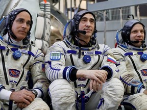 Crew members of the International Space Station Chris Cassidy (left) of NASA, Anatoly Ivanishin (centre) and Ivan Vagner (right) of the Russian space agency Roscosmos, pose for a photo as they attend the final qualification training for the upcoming space mission in Star City near Moscow, Russia, March 12, 2020.