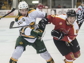 Noah Philp of the University of Alberta Golden Bears skates against Chris Rauckman of the University of Calgary Dinos at Clare Drake Arena on Jan. 24, 2020.