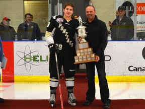 Brinson Pasichnuk of the Bonnyville Pntiacs is presented the award for the top defenceman by AJHL commissioner Ryan Bartoshyk on Sunday February 28, 2016 in Cold Lake, Alta.