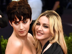 Madonna (R) and Katy Perry (L) arrive at the Costume Institute Gala Benefit at The Metropolitan Museum of Art May 5, 2015 in New York. (TIMOTHY A. CLARY/AFP via Getty Images)