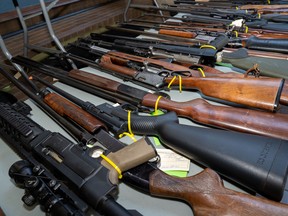 Police have seized 28 firearms and thousands of identity documents after a 16-month investigation.