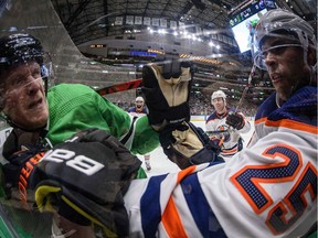 Dallas Stars right wing Corey Perry (10) fights with Edmonton Oilers defenceman Darnell Nurse (25) at American Airlines Center on March 3, 2020.