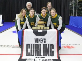 University of Alberta Pandas skip Selena Sturmay (left), coach Garry Coderre, third Abby Marks, second Kate Goodhelpsen, extra Catherine Clifford and lead Paige Papley pose with the 2020 U-Sports national title after defeating the University of New Brunswick Reds 10-2 in the final on Sunday, March 15, 2020, in Portage la Prairie, Man.