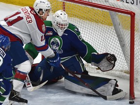 Edmonton Oil Kings forward Dylan Guenther (11) can't get the puck past Swift Current Broncos goalie Isaiah DiLaura (30) at Rogers Place on Friday, March 6, 2020.