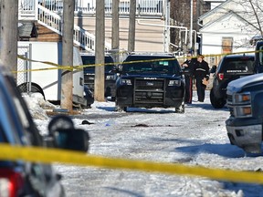 Police investigate an occurrence in the back alley near 96 Street and 106 Avenue in Edmonton on Monday, March 9, 2020.