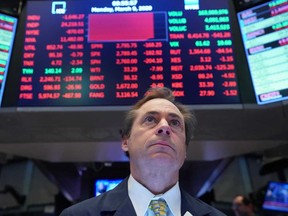A trader works on the floor of the New York Stock Exchange (NYSE) in New York, U.S. on Monday.