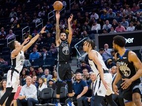Warriors guard Mychal Mulder (15) shoots against the Clippers in the second half at Chase Center in San Francisco, on Tuesday, March 10, 2020.