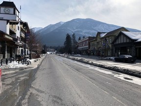 No traffic and very few visitors walk the street of Banff on March 21.